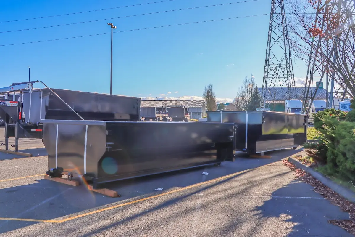 Roll-off dumpster ready for waste disposal at job site for 2 Yard Dumpster Rental in Black Jack